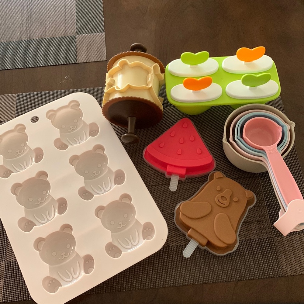 Plastic measuring cups and spoons, plus Holiday Cookie Cutters, ice cream tools